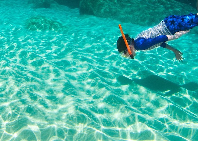 John trying to find fish on the beach in Cozumel.