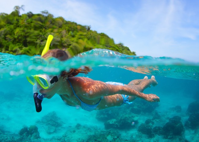 Dorothy snorkeling on the surface of the Villa Blanca Reef.
