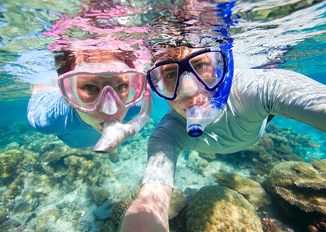Bruce and his sister having a good time in the shallow waters of Cozumel.